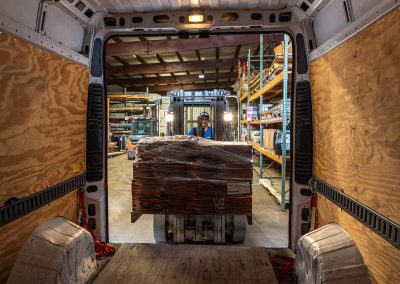 View from inside an Elite Transportation Systems cargo van as a forklift loads a pallet