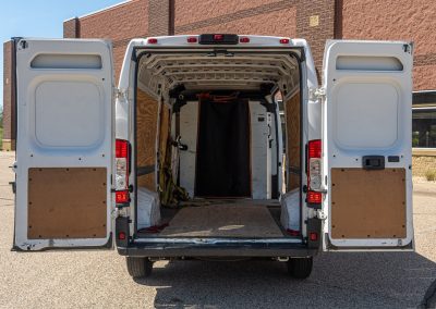 Rear doors open on an Elite Transportation Systems cargo van